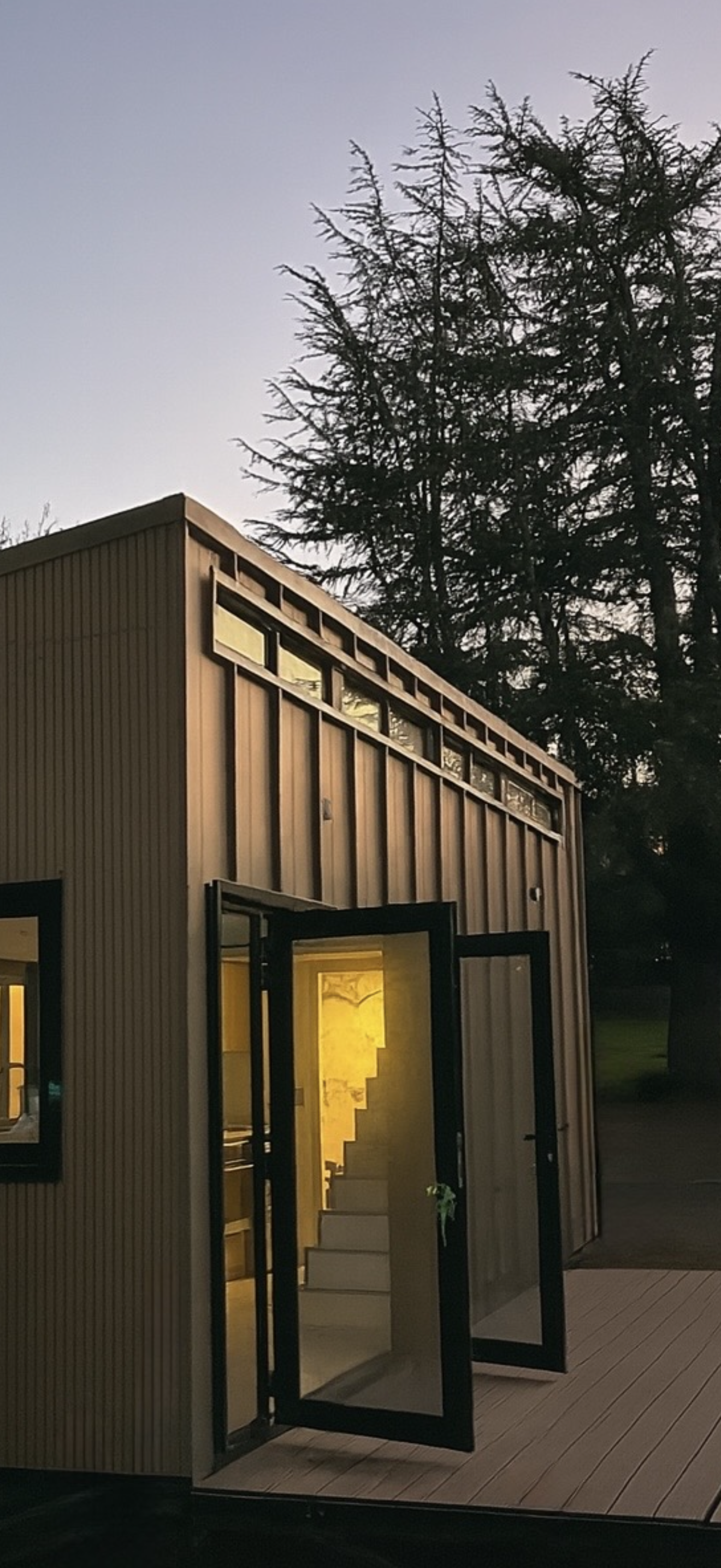 Bronze metal siding at sunset